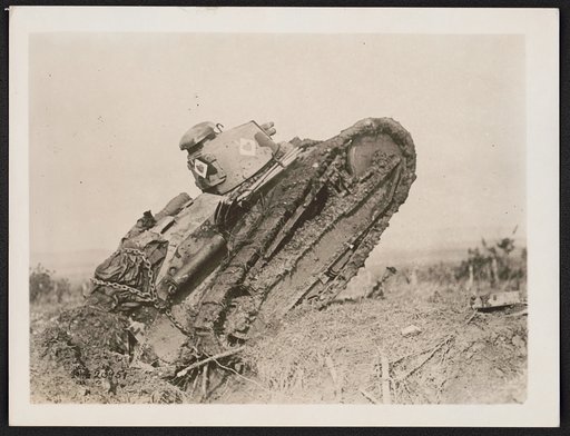 Tank ploughing its way through a trench and starting toward the German line, during World War I, near Saint Michel, France