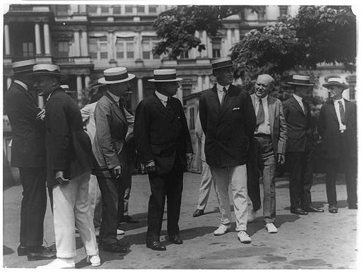 Governor Cox and Franklin D. Roosevelt surrounded by newspapermen as they arrived outside the White House for conference with Pres. Wilson