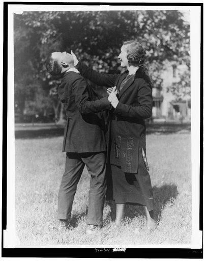 Policewoman and policeman practicing self-defense