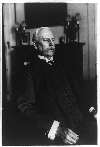 Lionel Carden, half-length portrait, seated, facing right