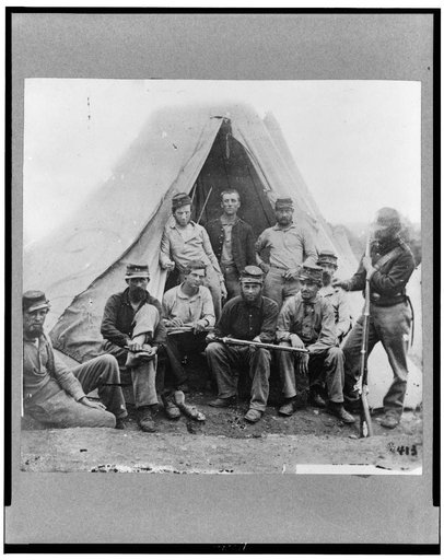 Group of soldiers of Co. G., 71st New York Volunteers, posed in front of tent