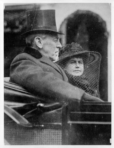 Woodrow Wilson and wife riding in backseat of a carriage to second inauguration, March 5th, 1917
