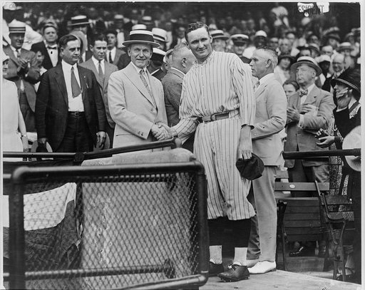 President Coolidge shaking hands with Walter Johnson at Griffith Stadium