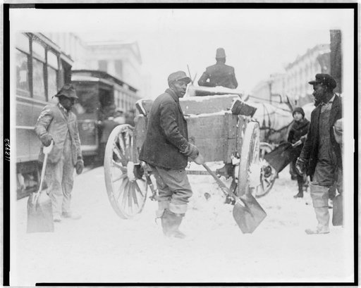 African American men shovelling snow in street, Washington, D.C.(?)
