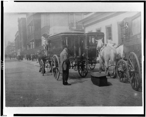Horse-drawn hearses in front of funeral parlor, New York City(?)