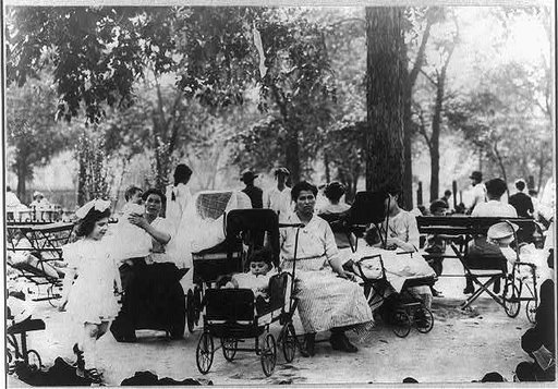 Mothers and children in a city park on a hot day, New York City