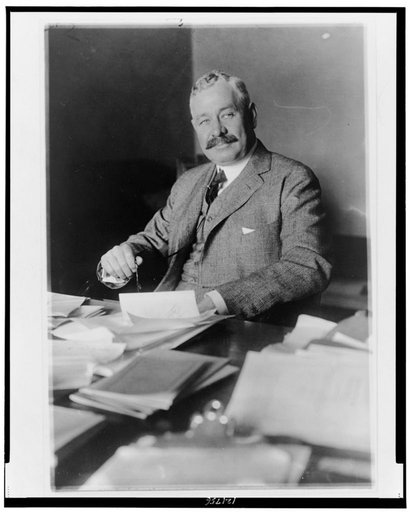 Joseph S. Frelinghuysen, half-length portrait, seated at desk, facing slightly left