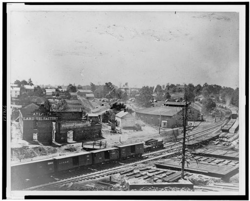 View of Atlanta, Georgia, with railroad cars in left foreground