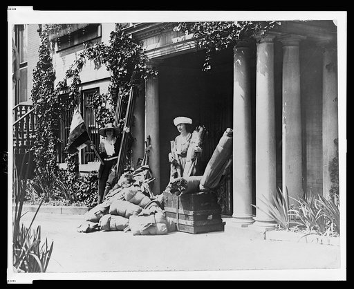 Miss Julia Emory and Miss Bertha Graf with luggage and flags, leaving Washington, D.C. for a suffrage demonstration at Marion, Ohio, the home of Warren Harding