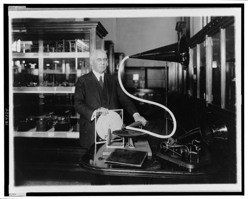 Emile Berliner, with the model of the first phonograph machine which he invented