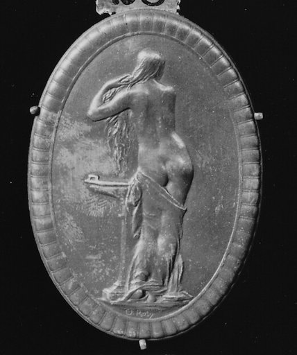 Young Greek woman making her toilet
