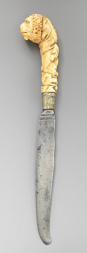 Table knife with handle carved with lion's head