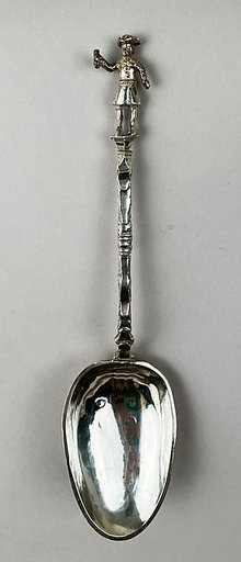 Figure-top spoon