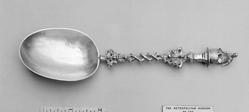 Figure-top spoon