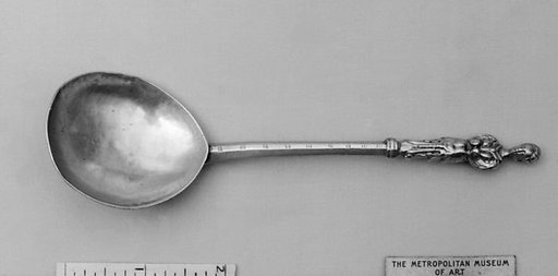 Figure-top spoon