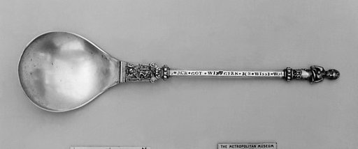 Figure-top spoon