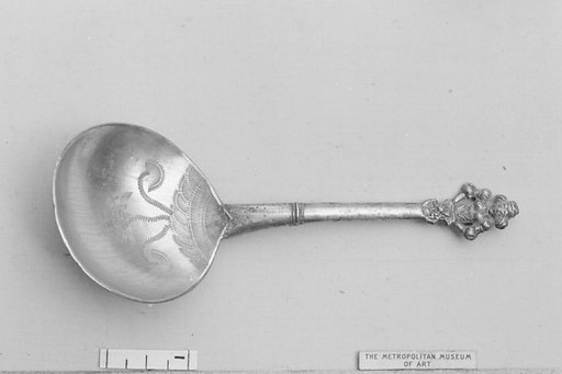 Figure-top spoon