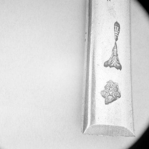Section of a spoon handle
