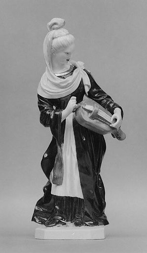 Woman playing a hurdy-gurdy