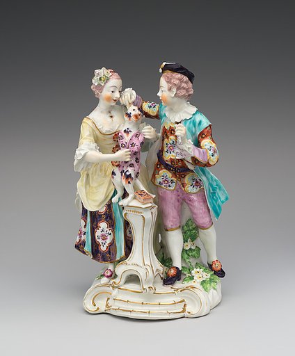 Man and girl with dog dressed as harlequin