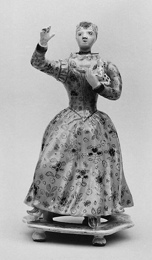 Standing woman holding a dog