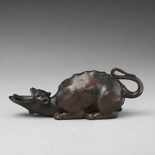 Oil lamp in the form of a grotesque animal