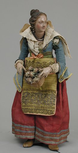 Girl carrying basket of onions