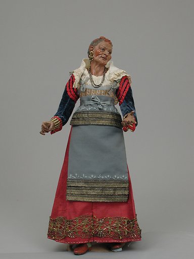 Old woman carrying a wire basket