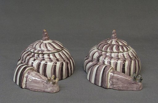 Pair of boxes with covers in the form of snails