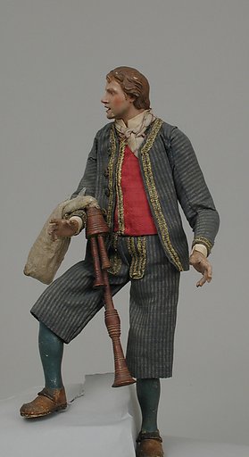 Young man in suit with bagpipes