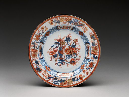 Plate with a vase of flowers