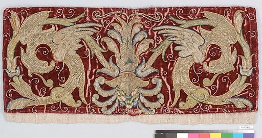 Fantastical birds against a red ground