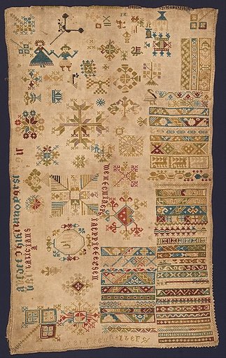 Sampler with geometric patterns, lettering, and various motifs