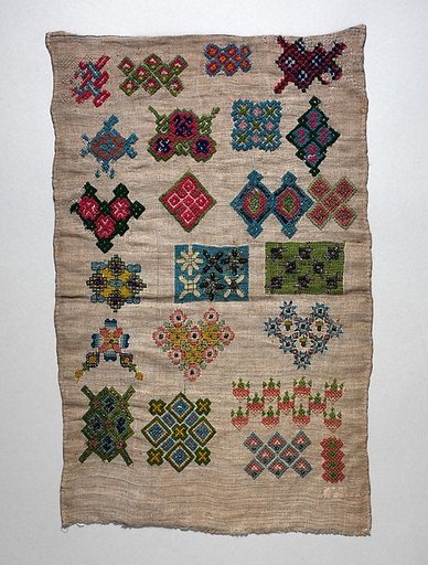 Sampler with geometric motifs