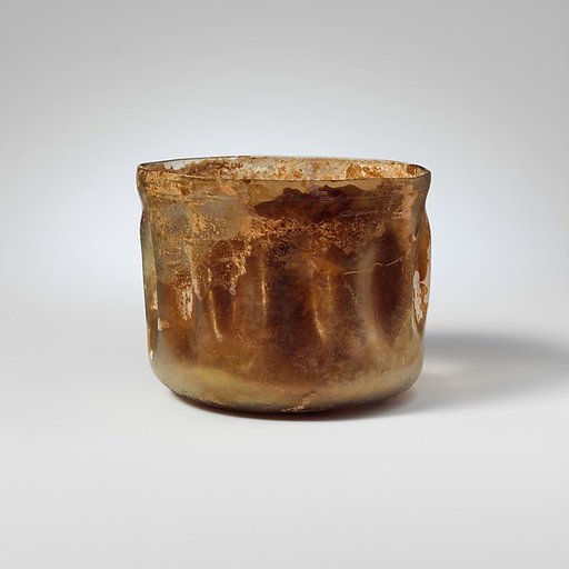 Glass cup with indented sides