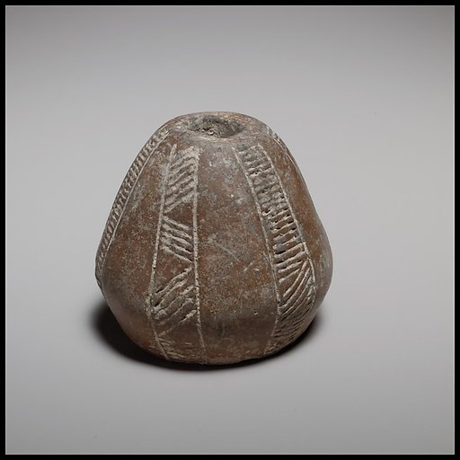 Truncated-biconical spindle-whorl with flat base