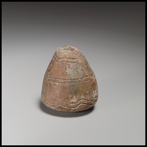 Conical-hemispherical spindle-whorl with slightly rounded base