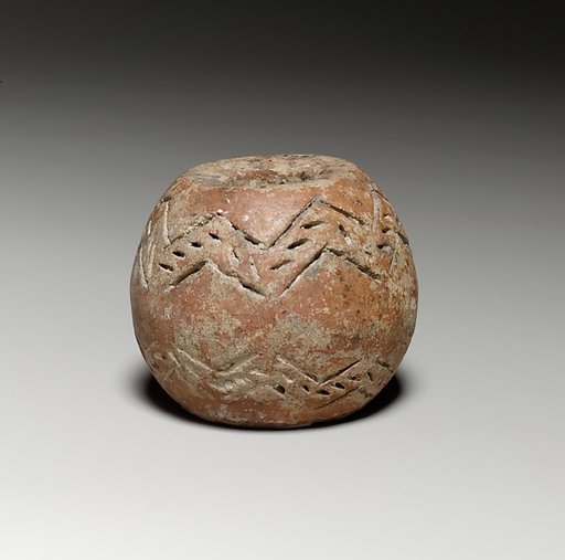 Spherical spindle-whorl with broad flat top and base