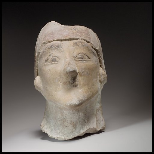 Beardless male head wearing a helmet