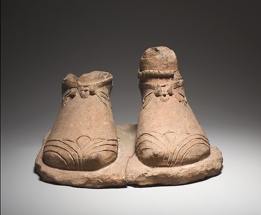 Feet on a plinth