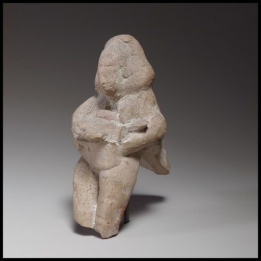 Seated female figurine