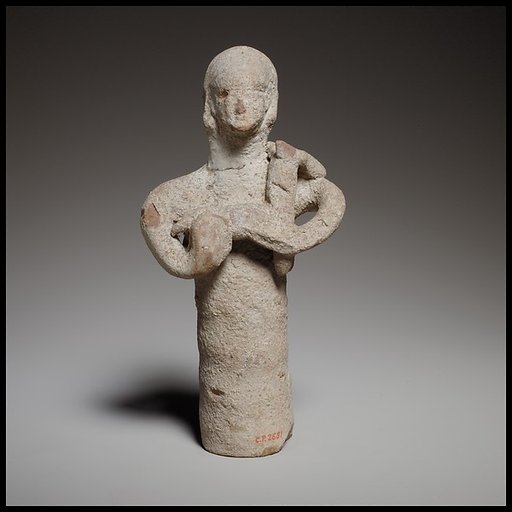 Standing figurine holding a quadruped