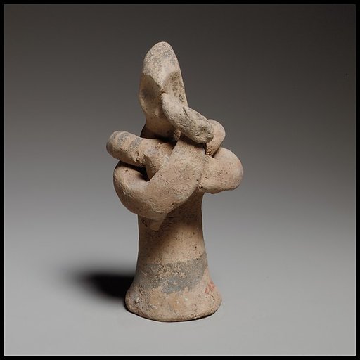 Standing male flute player with a serpent around his shoulders