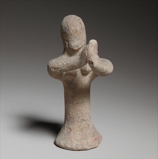 Standing female tambourine player