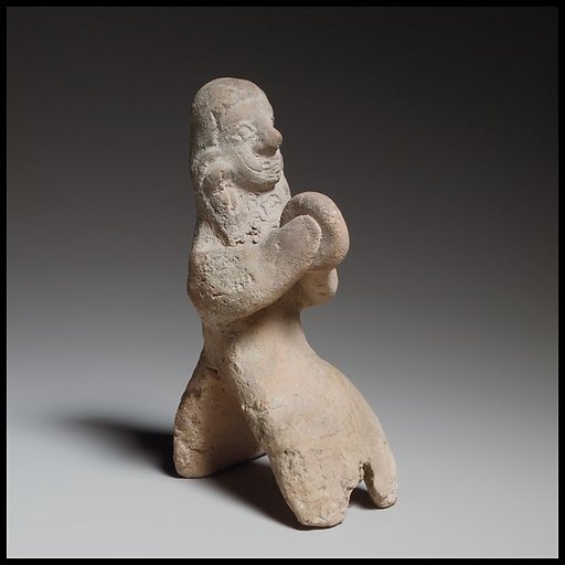 Seated female tambourine player