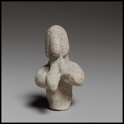 Statuette of a votary playing flute