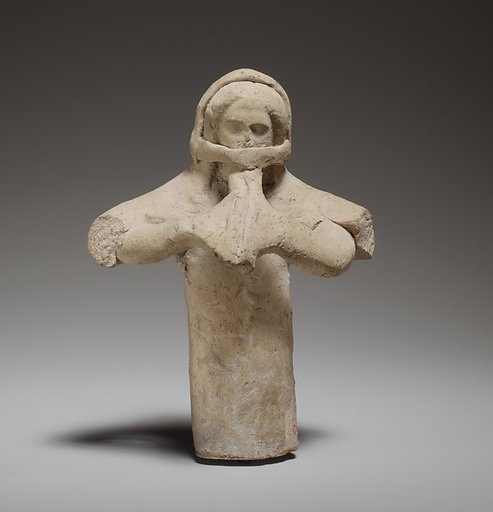 Standing female flute player