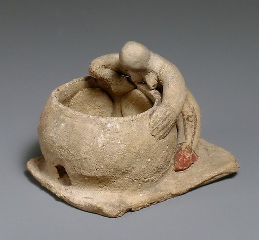 Terracotta woman baking bread