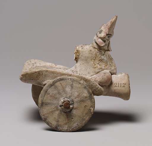 Model of a cart with a human figure
