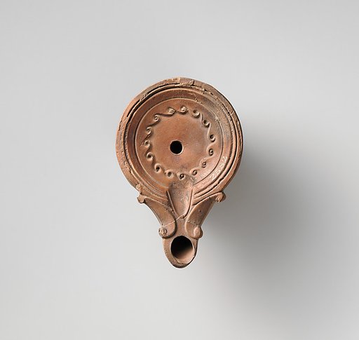 Terracotta oil lamp